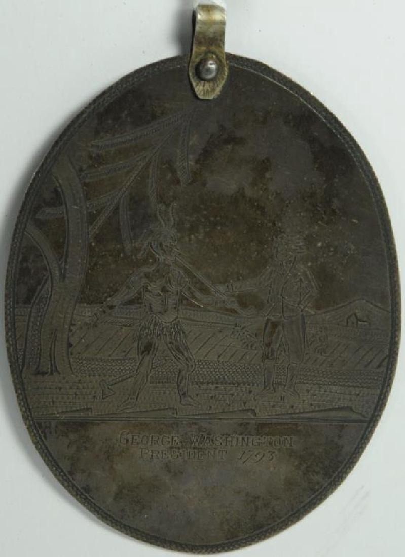FINE LARGE EARLY ENGRAVED SILVER PENDANT SHOWS: INDIAN AND COLONIAL FARMER, INSCRIBED GEORGE WASHINGTON, PRESIDENT 1793. OVAL SHAPE 4" X 3". OBVERSE: "GEORGE WASHINGTON PRESIDENT 1793", REVERSE: "JR". SCENE: FARMER WITH INDIAN SMOKING PEACE PIPE WI