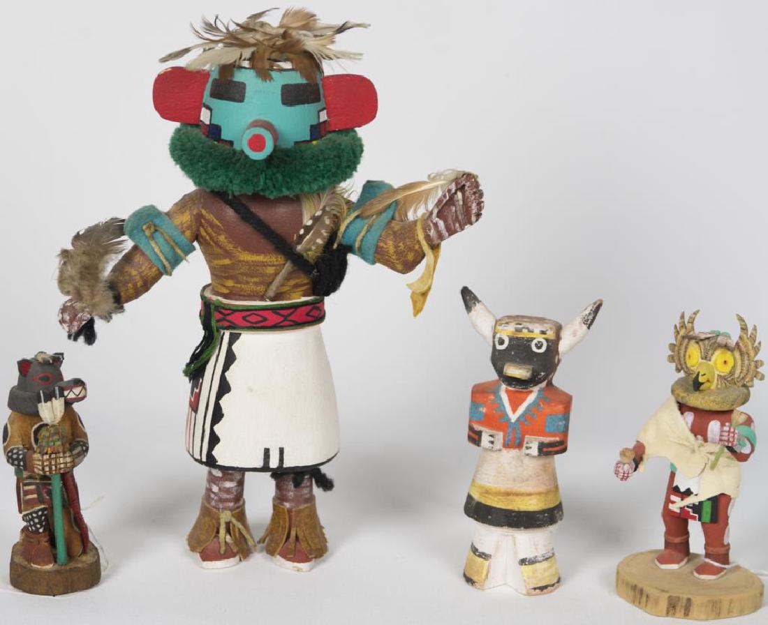 FOUR HOPI KACHINAS, “RASP”, TURQUOISE GREEN CASE: MASK, WITH RED EARS AND TUBE MOUTH, WHITE AND BLACK KILT, 11” H; “BUFFALO”, WITH BLACK CASE MASK, 5 ½” H; “WOLF”, SNOUT WITH TEETH, LEANING ON A FEATHERED TURQUOISE PAINTED CASE, SIGNED �
