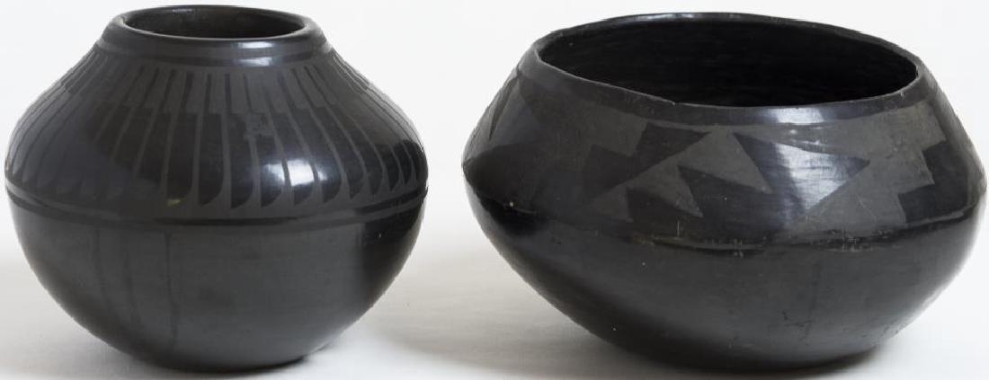 SAN ILDEFONSO BLACK ON BLACK POTTERY OLLA, SIGNED: ON BOTTOM “BLUE CORN, SAN ILDEFONSO PUEBLO”, 5 ½” H, 6 ½” W; EARLIER BLACK ON BLACK POTTERY BOWL, SAWTOOTH MOUNTAIN DESIGN, 5” H, 8 ½” W.