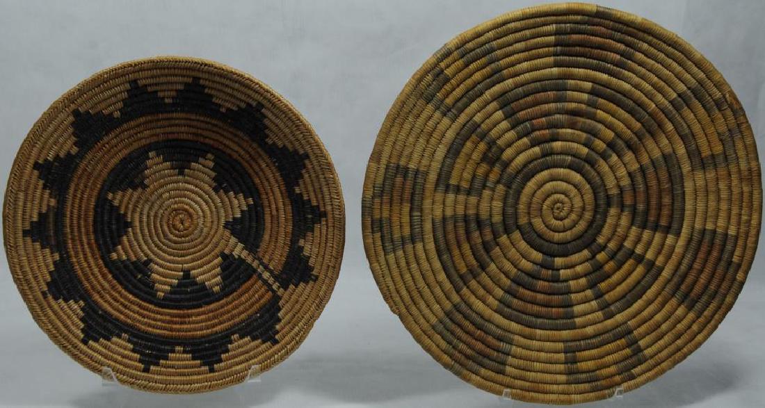 2 BASKETRY TRAYS TO INCLUDE VERY FINELY WOVEN: NAVAJO WEDDING BASKET WITH SPIRIT LINE, 10 1/4" W X 1 3/4" H, CA. 1940, ALTHOUGH THIS BASKET IS CALLED 'NAVAJO' SAN JUAN PAIUTE AND UTE WEAVERS FILLED THE NEED FOR CEREMONIAL BASKETS FOR NAVAJO. VERY 