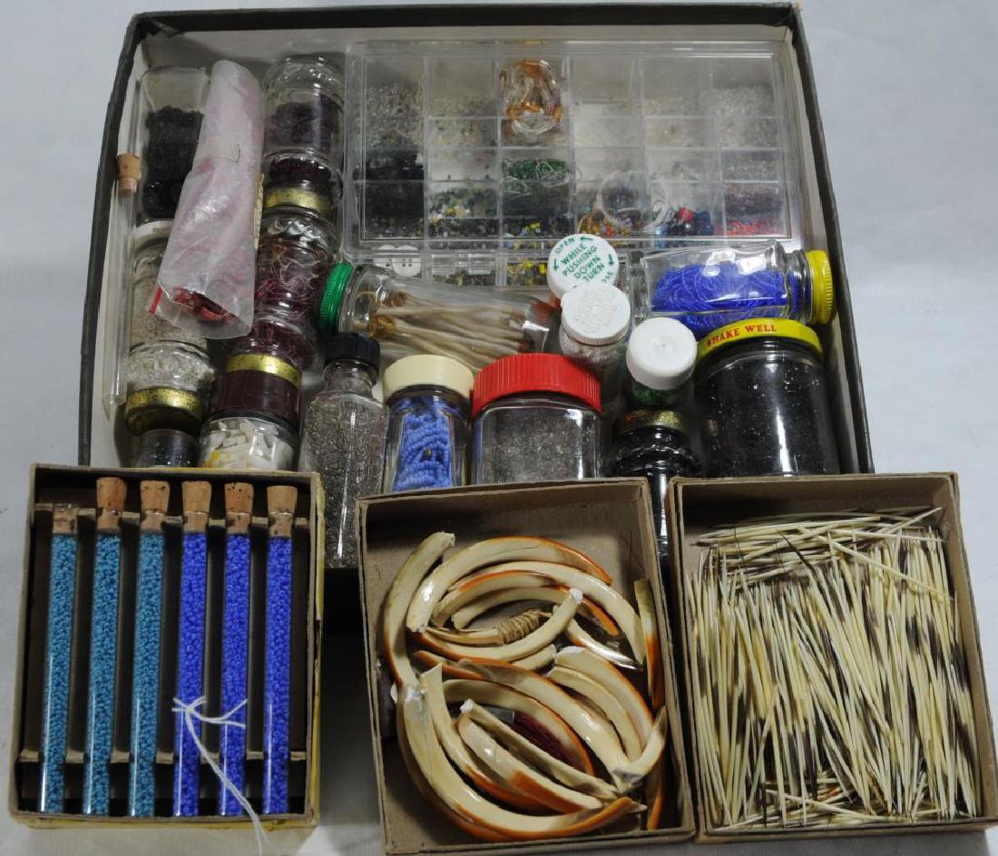 LARGE COLLECTION OF BEADS, BONES, TUSKS, QUILLS,: ETC. 4 PACKAGES OF SEED BEADS 2 PACKAGES OF "#205 ROCAILLE BEADS" IN PINK AND PURPLE; 1 OF "#210 BUGLE BEADS", LONG, FACETED, DARK PINK; AND 1 OF "215 SEED BEADS", SILVER.