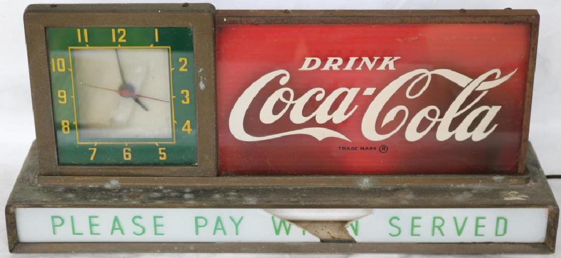 COCA-COLA ADVERTISING CLOCK, BOTTOM GLASS BROKEN,: 9" H X 19 1/2" W X 4 3/4" D, BAD CORD, UNKNOWN WORKING CONDITION, LIGHTS UP