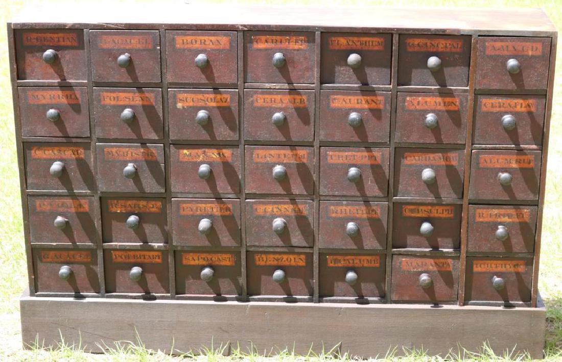 19TH C. 35 DRAWER APOTHECARY CABINET, ORIGINAL: FINISH, REPLACED BASE, PINE, 34" H X 50 3/4" W X 10" D, DOVETAILED CONSTRUCTION