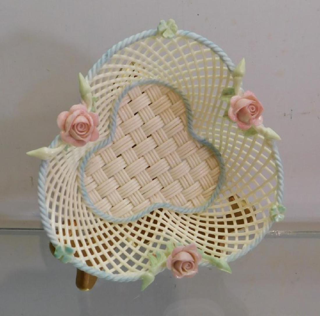 BELLEEK SHAMROCK BASKET W/ APPLIED ROSES: AND BLUE BRAIDED RIM, BELLEEK IRELAND INCISED MARK, APPRX 5" ACROSS