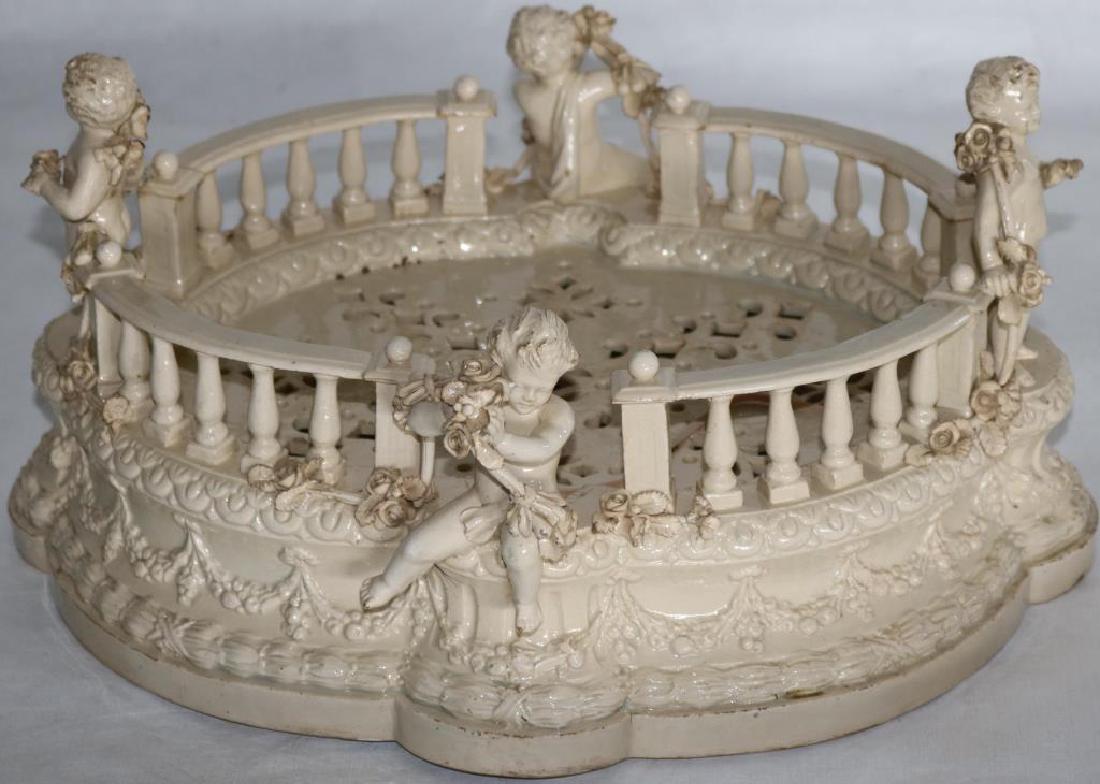 ITALIAN EARTHENWARE CENTERPIECE W/ 4 CHERUBS,: GARDEN FORM, APPROX. 7 1/2" X 14 1/2" X 12 1/2", STANDING CHERUB RESTORED