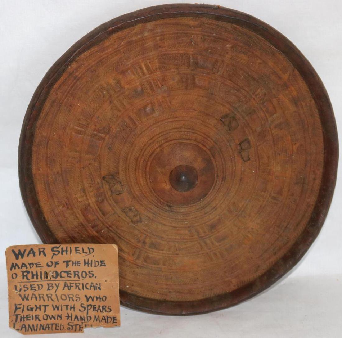 19TH C. AFRICAN RHINOCEROS HIDE WAR SHIELD,: GEOMETRIC DESIGN, 12" DIAMETER