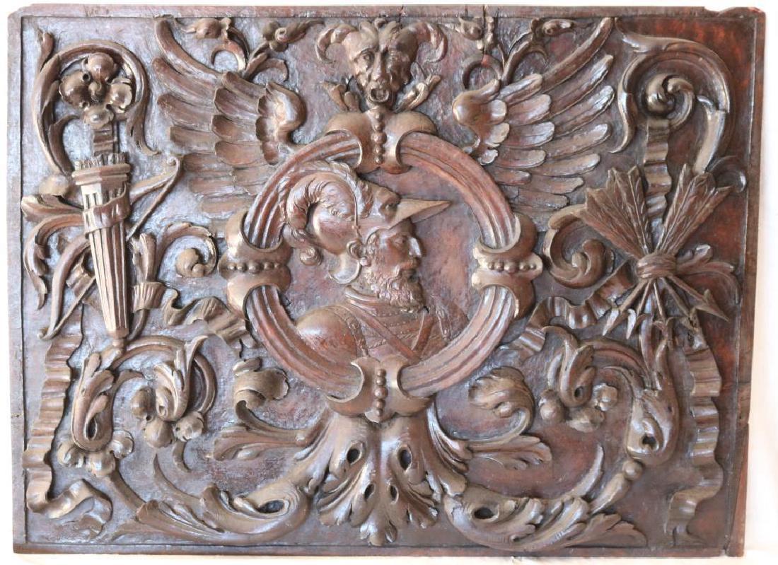 ORNATE CARVED WOODEN PLAQUE DEPICTING RENAISSANCE: MAN W/ SCROLL WING, QUIVER AND ARROW DESIGN, 26" X 35 1/4"