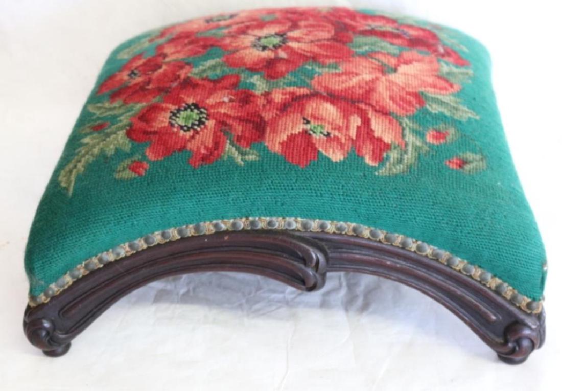 UNUSUAL CARVED WALNUT ARCH FORM FOOT STOOL: W/ FLORAL NEEDLEPOINT COVER, 7"X 16" X 16"