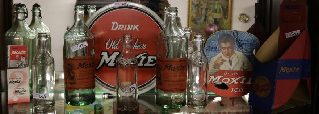 9 PCS MOXIE ADVERTISING INC 6 BOTTLES, ROUND SIGN,: BOTTLE CARRIER, LITHO TRAY AND HANGING SIGN, 8" TO 11"H