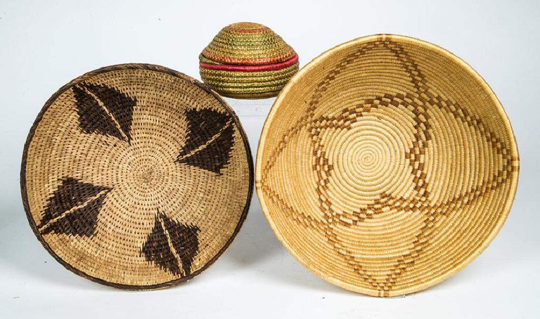 THREE BASKETS: COILED BOWL WITH CENTRAL STAR DESIGN, 4 3/4" H, 12" DIA; MULTI-COLOR BASKET, ROUND WITH LID (STRING HOLDER), 3 1/2" H, 5" DIA; ROD WOVEN BASKET, FOUR BLACK DIAMONDS WITH WHITE STRIPES, 4" H, 11" DIA.