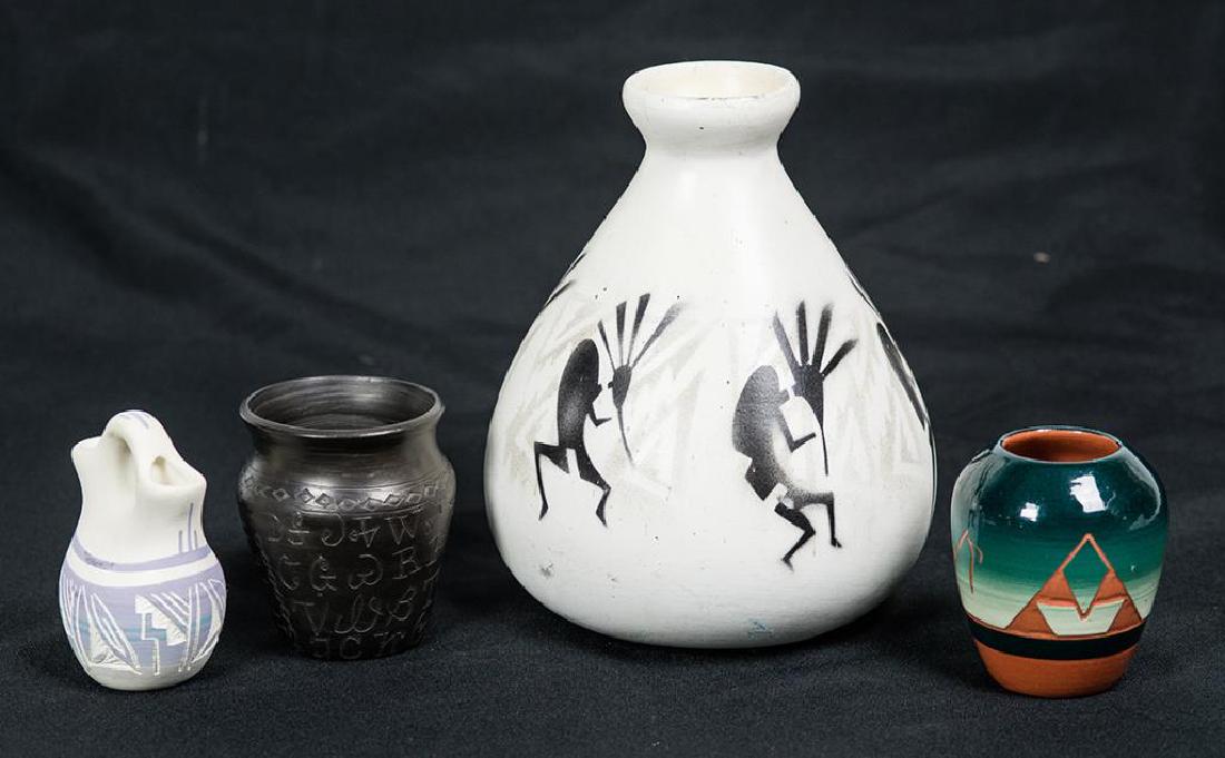 FOUR POTTERY PIECES: TALL PEAR SHAPED VASE, WHITE WITH BLACK STENCIL DECORATION OF SIX DANCING FLUTE PLAYERS, "KOKOPELI", SIGNED " M. REDHORSE, NAVAJO", "HOZONI POTTERY", 8 1/2" H; SMALL RED POT WITH BLUE/GREEN AND BLACK 