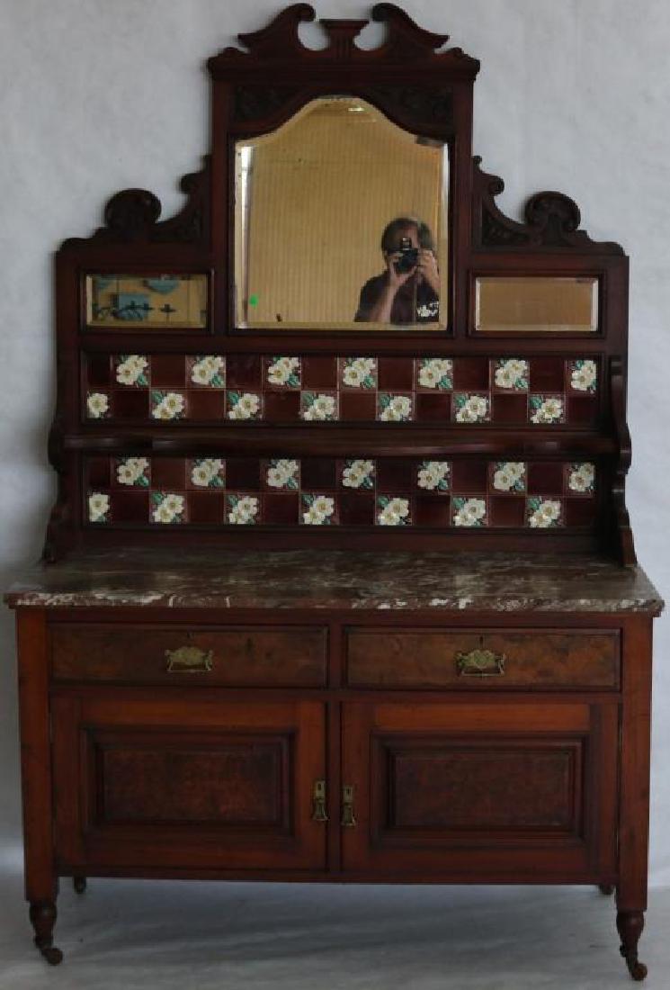 LATE 19TH C. WALNUT WASHSTAND WITH CARVED CREST,: BEVELED MIRRORS & FLORAL TILE BACK, MARBLE TOP WITH 2 DRAWERS OVER 2 DOORS WITH BURL PANELS, ORIGINAL FINISH, 73" H, 48" W, 21 1/2" D