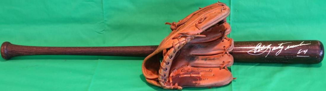 CARL YASTRZEMSKI SIGNED GLOVE AND BAT. THE GLOVE: IS SPAULDING. CARL YASTRZEMSKI MODEL 42 9925 USED CONDITION, SIGNED TO LEE. THE BAT IS A LOUISVILLE SLUGGER #125, C271 FINISH. 34" LONG. NEAR MINT CONDITION.