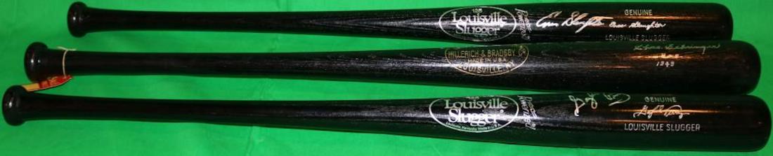 LOT OF 3 HALL OF FAME LOUISVILLE SLUGGER BATS TO: INCLUDE A SIGNED ENOS SLAUGHTER, BLACK FINISH, 33 3/4" LONG. A SIGNED CHARLES GEHRINGER, 1949 HALL OF FAME, BLACK FINISH 34 3/4" LONG. AND A SIGNED GAYLORD PERRY 33 3/4" LONG, BLACK FINISH.