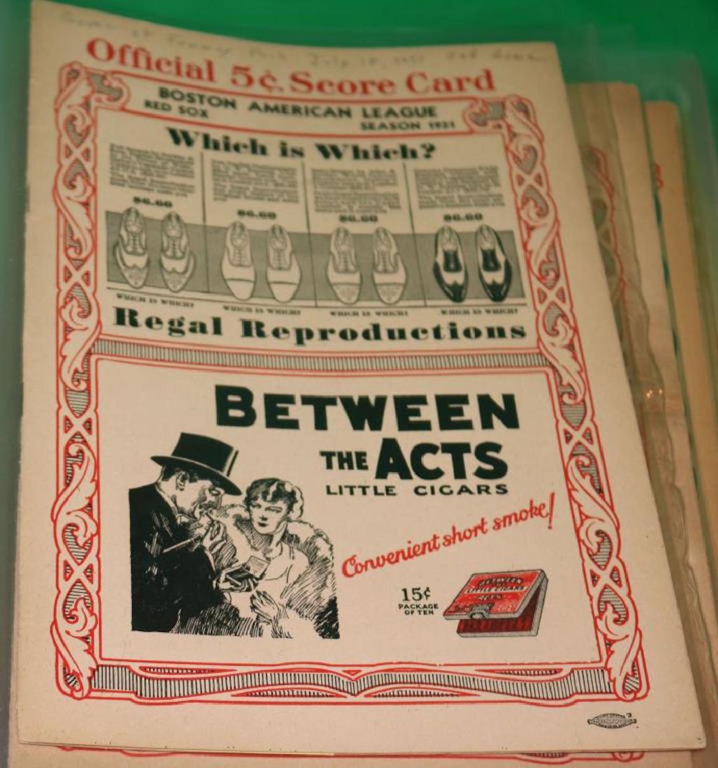 1 BINDER CONTAINING 30 PIECES OF BASEBALL: EPHEMERA INCLUDING RED SOX YEARBOOKS, SCORE BOOKS, TICKETS AND ADVERTISING.