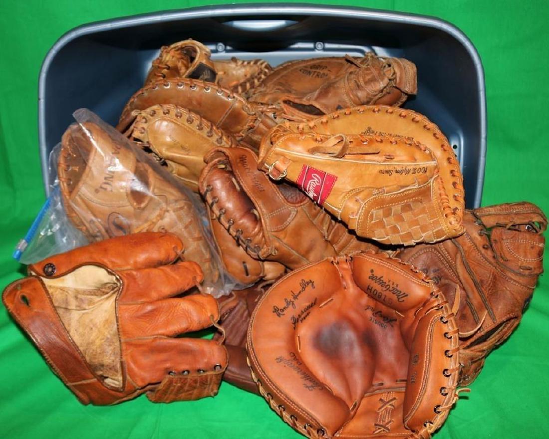 LOT OF 22 USED VINTAGE BASEBALL GLOVES. THEY: RANGE IN AGE FROM MID TO LATE 20TH CENTURY.