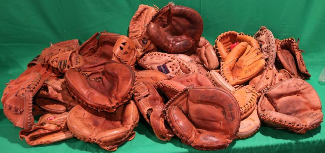 LOT OF 33 VINTAGE BASEBALL GLOVES, 1950'S TO 2000: AND INCLUDING ONE BRAND NEW RAWLINGS CATCHERS MITT. MOSTLY CATCHER'S MITTS. CONDITION MOSTLY IN GOOD TO NEAR MINT, VARIOUS MAKERS.