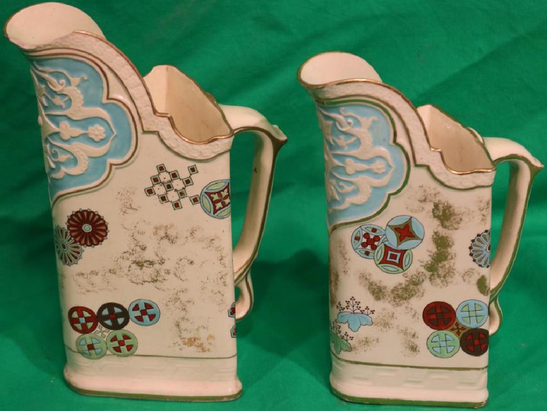 2 ROYAL WORCESTER HANDLED PITCHERS, LATE 19TH: C. SIMILAR PATTERNS, 7 3/4" H WITH SLIGHT HAIRLINE & 8 3/4" H WITH CHIP TO SPOUT