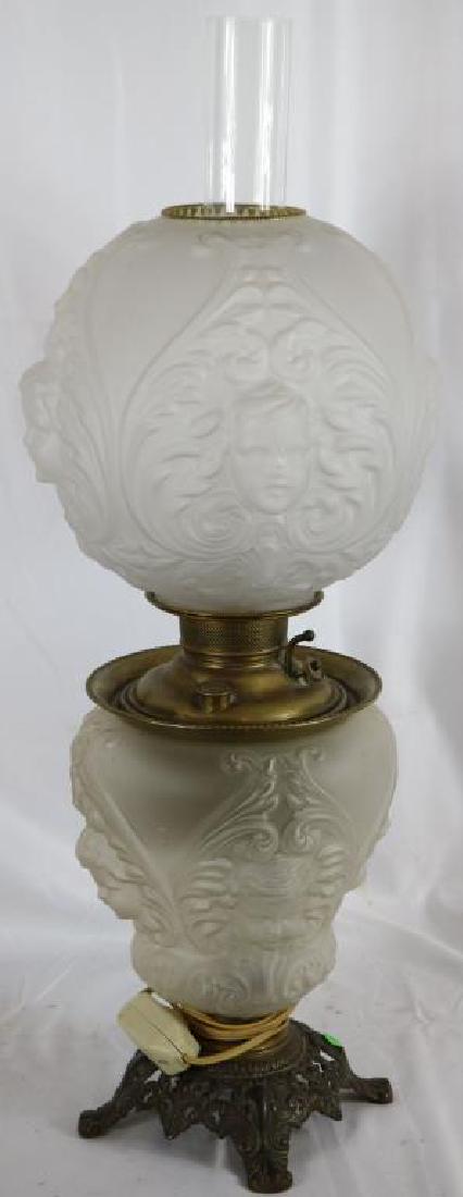 VICTORIAN GONE WITH THE WIND LAMP BY MILLER WITH: FROSTED EMBOSSED CHERUB HEADS, ELECTRIFIED, APPROX. 25" OVERALL, 10" BALL SHADE
