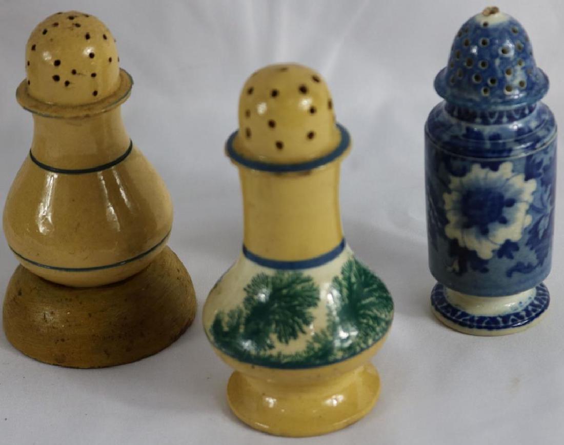 LOT OF 3 EARLY EARTHENWARE SHAKERS TO INCLUDE: 4" SEAWEED MOCHA, SHOW CHIPPING, UNUSUAL YELLOWARE BANDED SHAKEWARE WITH MALCE WOODEN BASE, 4 1/2", STAFFORDSHIRE SHAKER WITH MISSING FINIAL