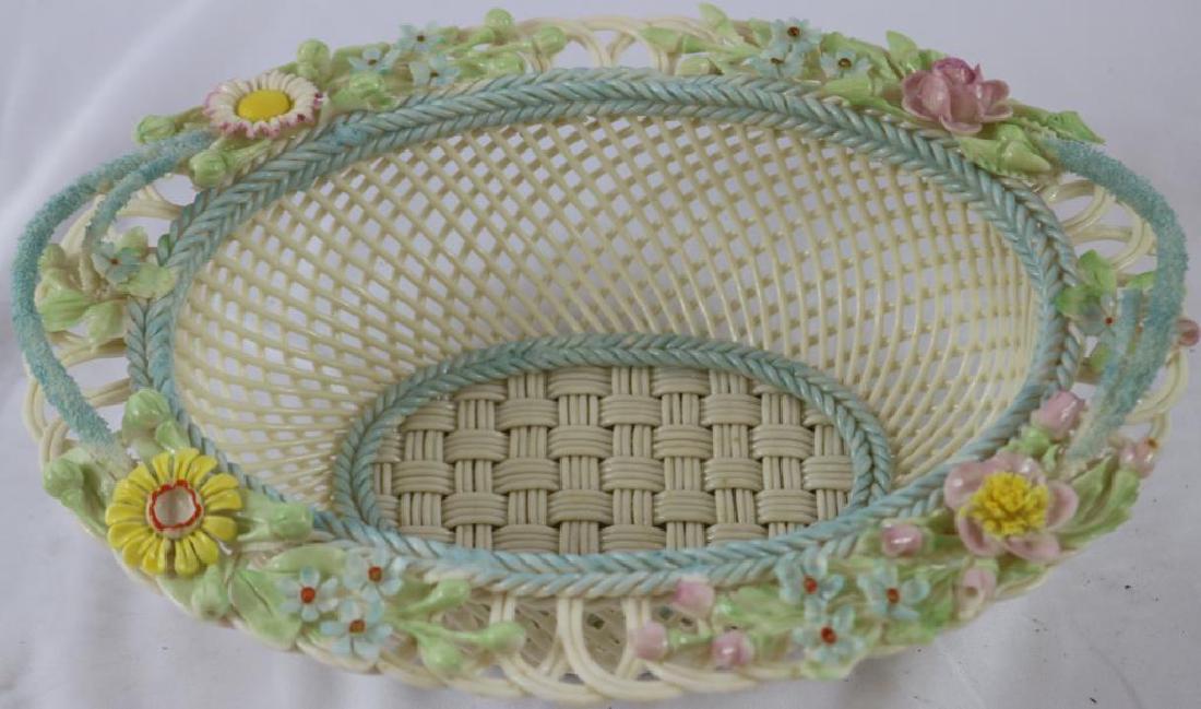 ORNATE BELLEEK PORCELAIN BASKET WITH OPEN WEAVE: DESIGN, APPLIED FLORAL DECORATION, NO VISIBLE DAMAGE, 3 1/4" H, 9" W, 7" D