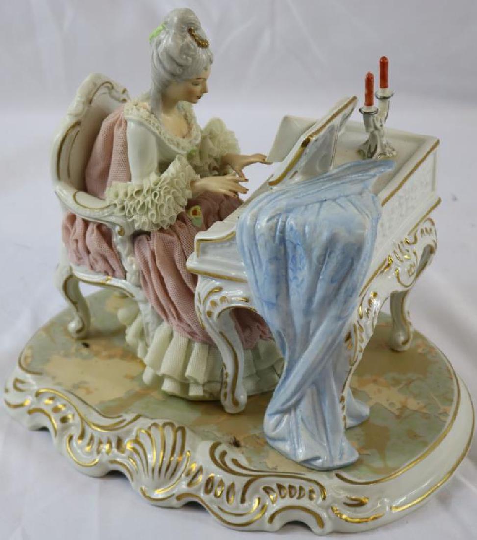 DRESDEN PORCELAIN FIGURE OF LADY AT PIANO, NO: VISIBLE DAMAGE, 8 3/4" H, 9 1/2" D, 8" W