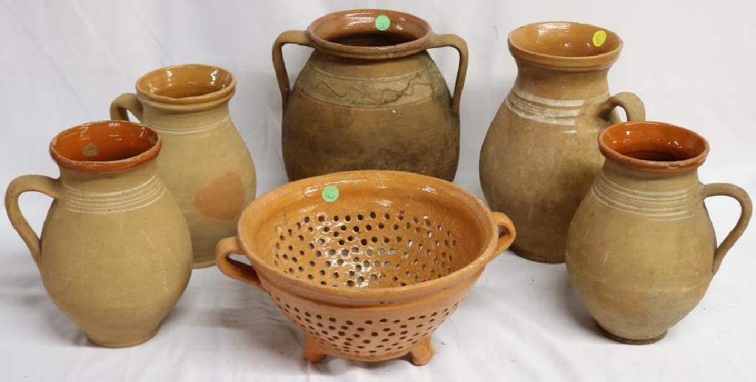 COLLECTION OF 6 EUROPEAN REDWARE ITEMS TO INCLUDE: 5 HANDLED JUGS AND COLANDER, 8 1/2" - 10 1/2" H, COLANDER IS 5 1/2" X 12" W