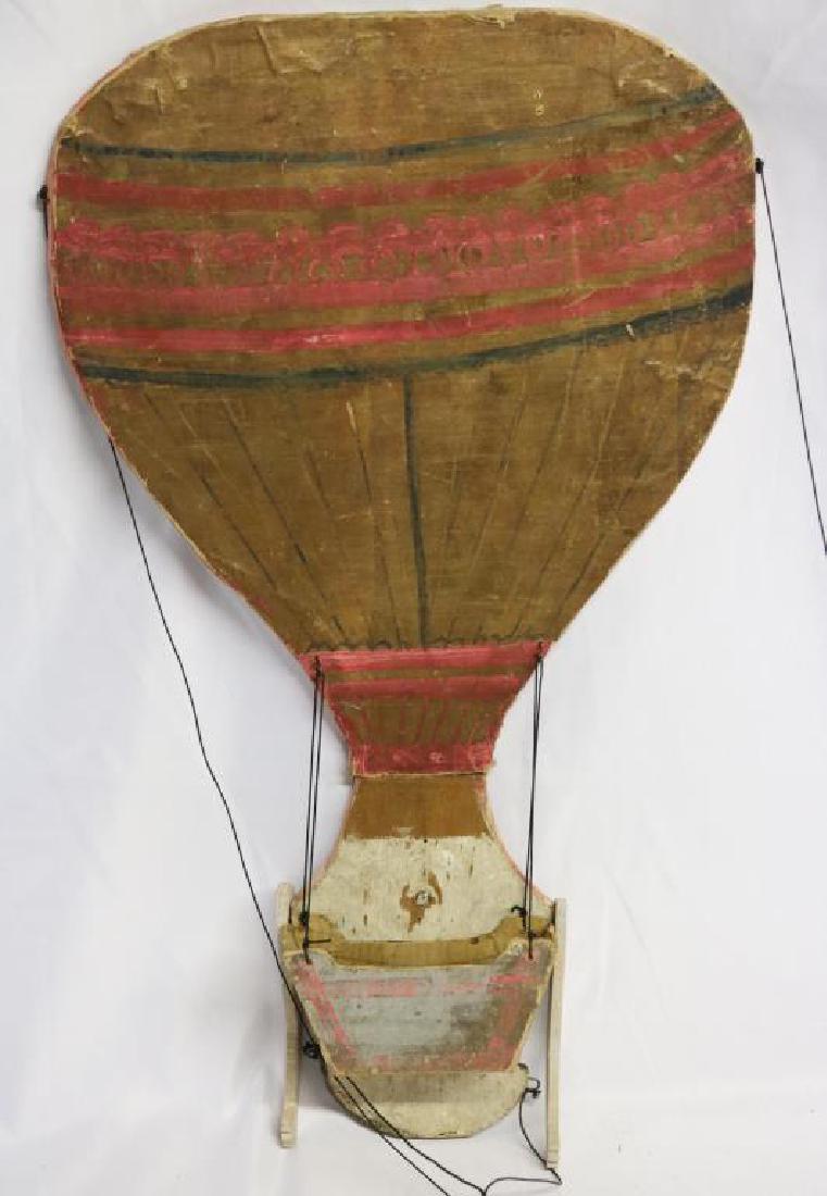 19TH C. TRANSFORMER PUPPET, TRANSFORMS FROM: BALLOON TO GIRL, 21" H, TOGETHER WITH 20TH C. JOINTED AFRICAN AMERICAN YOUTH, APPROX. 18" H