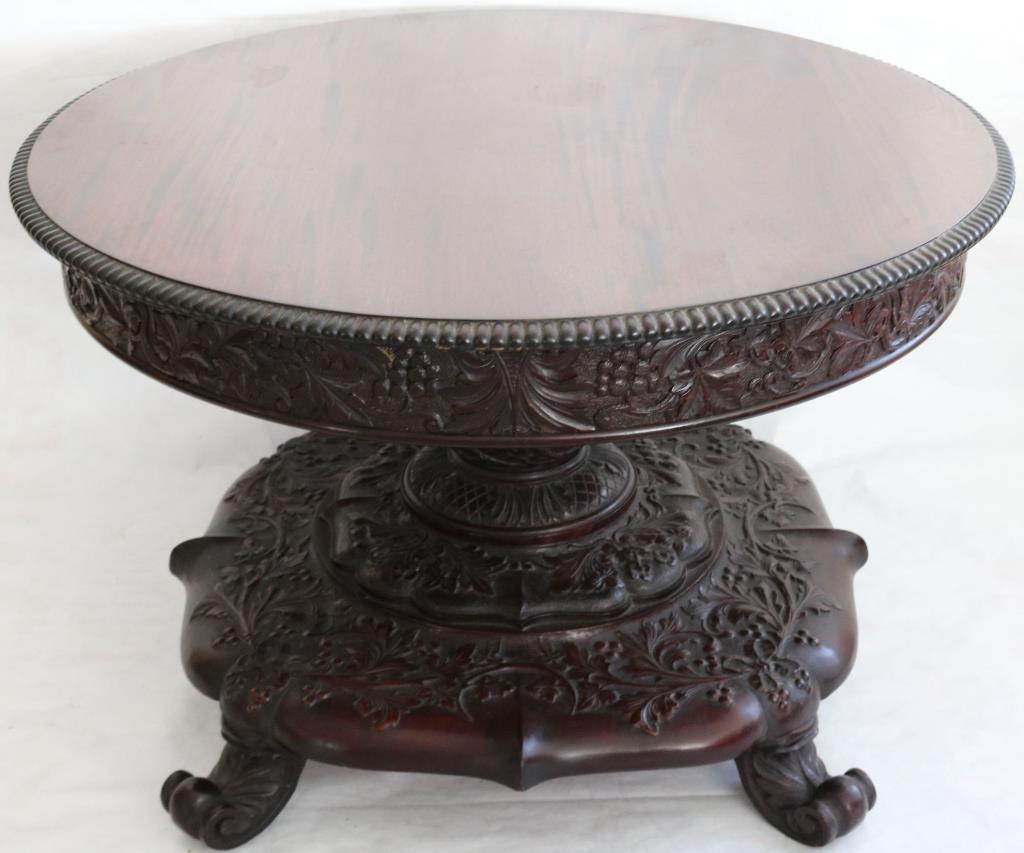 EXCEPTIONAL CARVED MAHOGANY ROUND TOP OCCASIONAL: TABLE, POSSIBLY DUTCH INDONESIAN, GADROONED TOP, WITH GRAPE & VINE FREEZE & PEDESTAL, LEAF & BERRY, BASE ON CAMPOS CARVED FEET, 28" H, APPROX. 43" DIA.