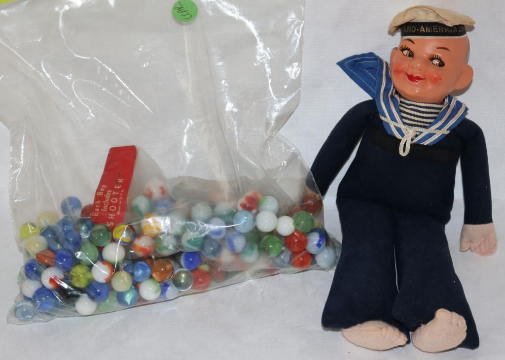 SAILOR DOLL, 11" H TOGETHER WITH BAG OF MARBLES: SEE PHOTO