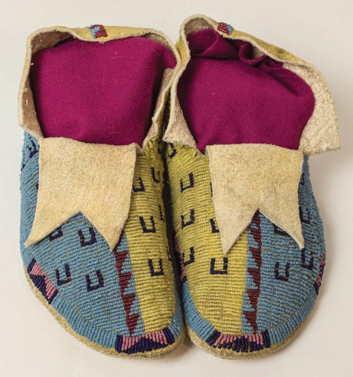 FINE EARLY 20TH C. CHEYENNE MOCCASINS, BEADED IN: YELLOW, LIGHT BLUE, PINK AND DARK BLUE HORSE TRAIL DESIGNS, NATIVE TANNED LEATHER AND RAWHIDE, 10 1/2" L.