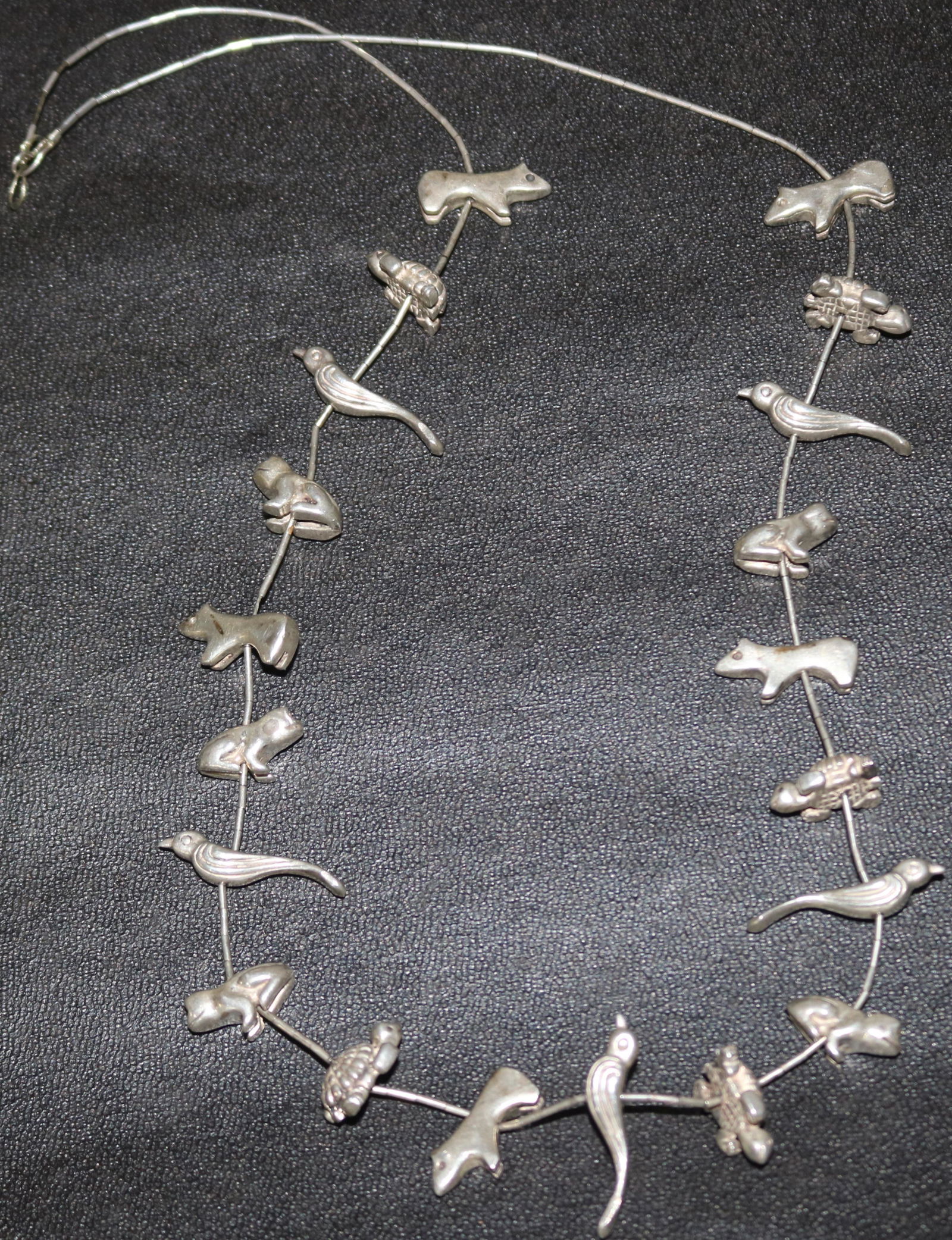 UNMARKED SILVER FETISH NECKLACE TO INCLUDE (1 of 2)