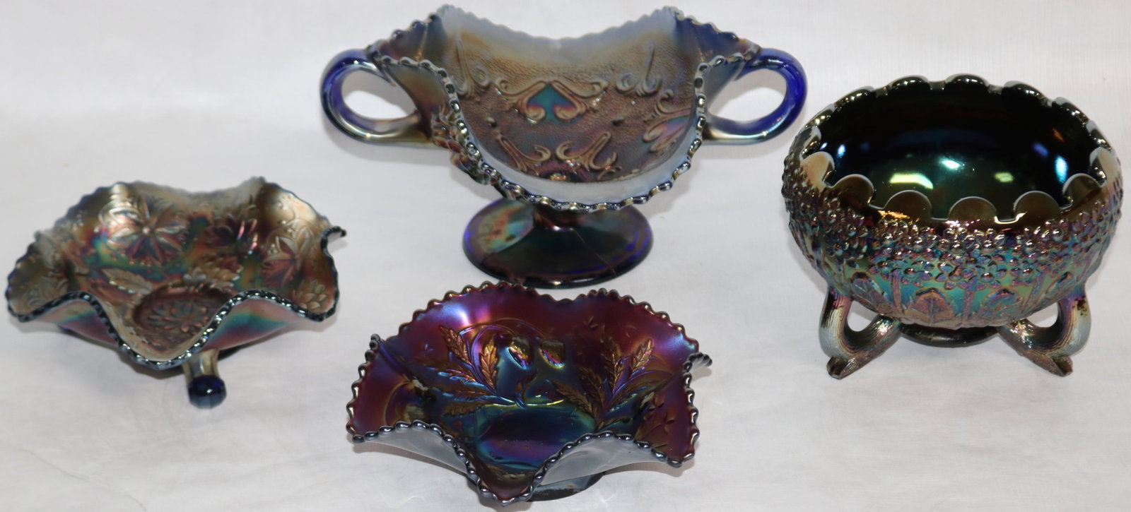 4 PCS. FOOTED & OTHER CARNIVAL GLASS INCLUDING: SIGNED FENTON NORTHWOOD, ETC. 2" - 4" H, 6" - 8 3/4" DIA.