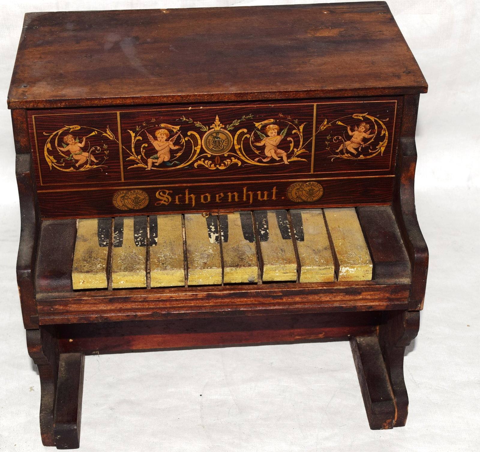LATE 19TH CENTURY SHOENHUT CHILD'S TOY PIANO WITH: STENCIL DECORATION 8 KEYS IN WORKING CONDITION 9.5" H X 10.25" W X 7.5" D
