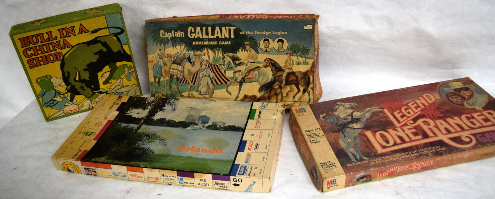 FOUR BOARD GAMES IN PLAYED CONDITION - CAPTAIN: GALLANT, LEGEND LONE RANGER, ORLANDOPOLY &