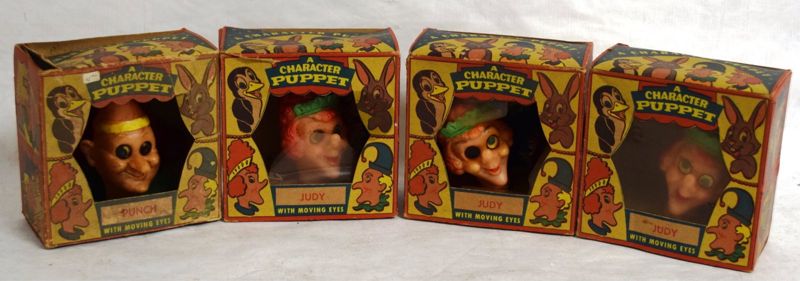 FOUR PETER PUPPY PLAYTHINGS HAND PUPPETS INCL: JUDY & PUNCH - SOME WEAR INCL. PIERCED FRONT PLASTIC