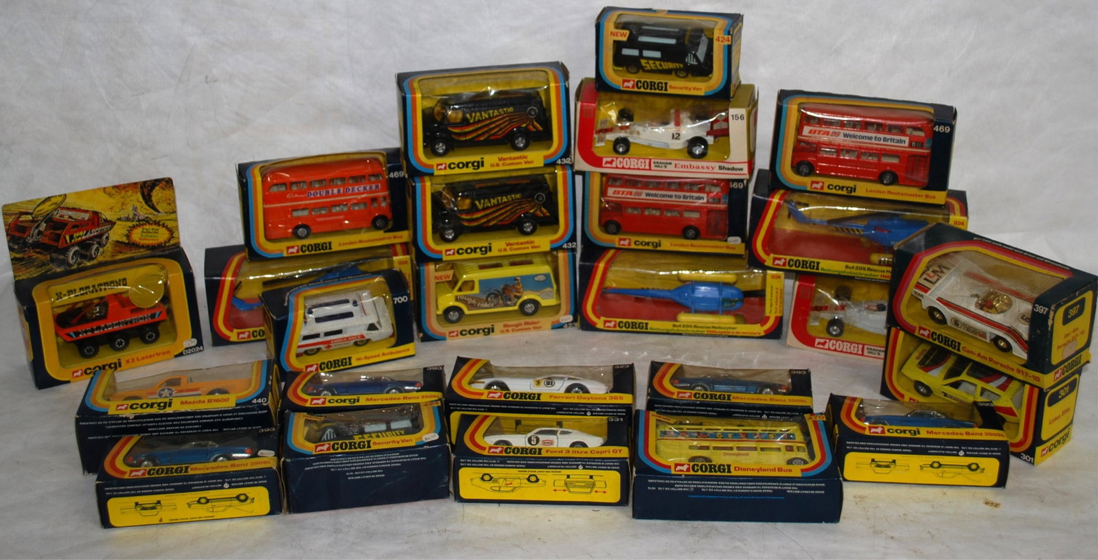 25 CORGI IN BOX VEHICLES INCL. RESCUE HELICOPTER,: GRAHAM HILL'S EMBASSY SHADOW, SECURITY VAN, VANTASTIC USA & HI-SPEED AMBULANCE