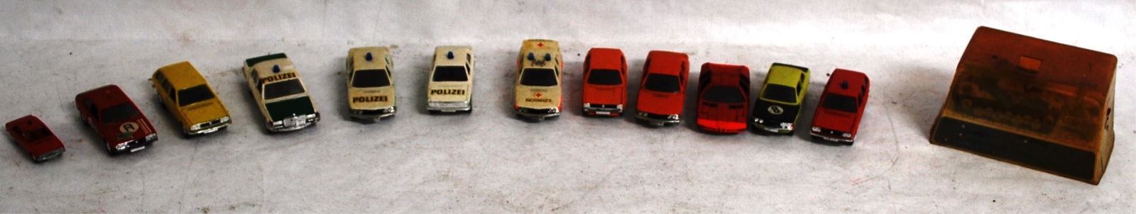 12 SCHUCO UNBOXED CARS: POLICE, TAXI, STATION: WAGON & COMBAT MINI SERIES TANK
