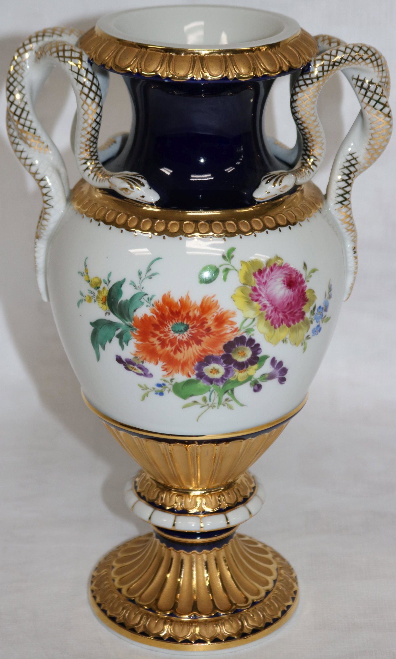 20TH C. MEISSEN URN FORMED VASE WITH, DOUBLE: SERPENT HANDLES PAINTED FLORAL DECORATIONS 11" H, NO VISIBLE DAMAGE