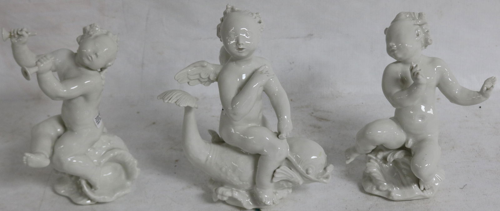 LOT OF 3 GERMAN CHENE DE BLANC FIGURES OF CHERUBS: NAUTICAL THEME, BERLIN SCEPTER KPM MARK, 1 ARM SHOWS POSSIBLE REPAIR. 7 1/2" H, 4" TO 6" W