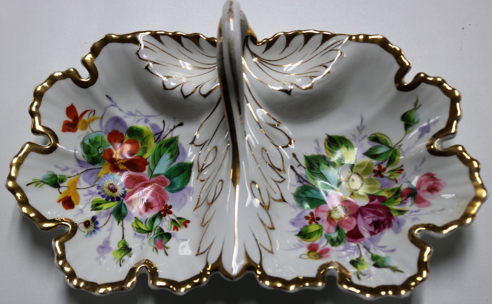 KPM HAND PAINTED & GILT DIVIDED DISH WITH HANDLE,: GILT SHOWS SOME WARE ON HANDLE 4 1/2" H, 13 1/2" W, 9 1/2" D APPROX.