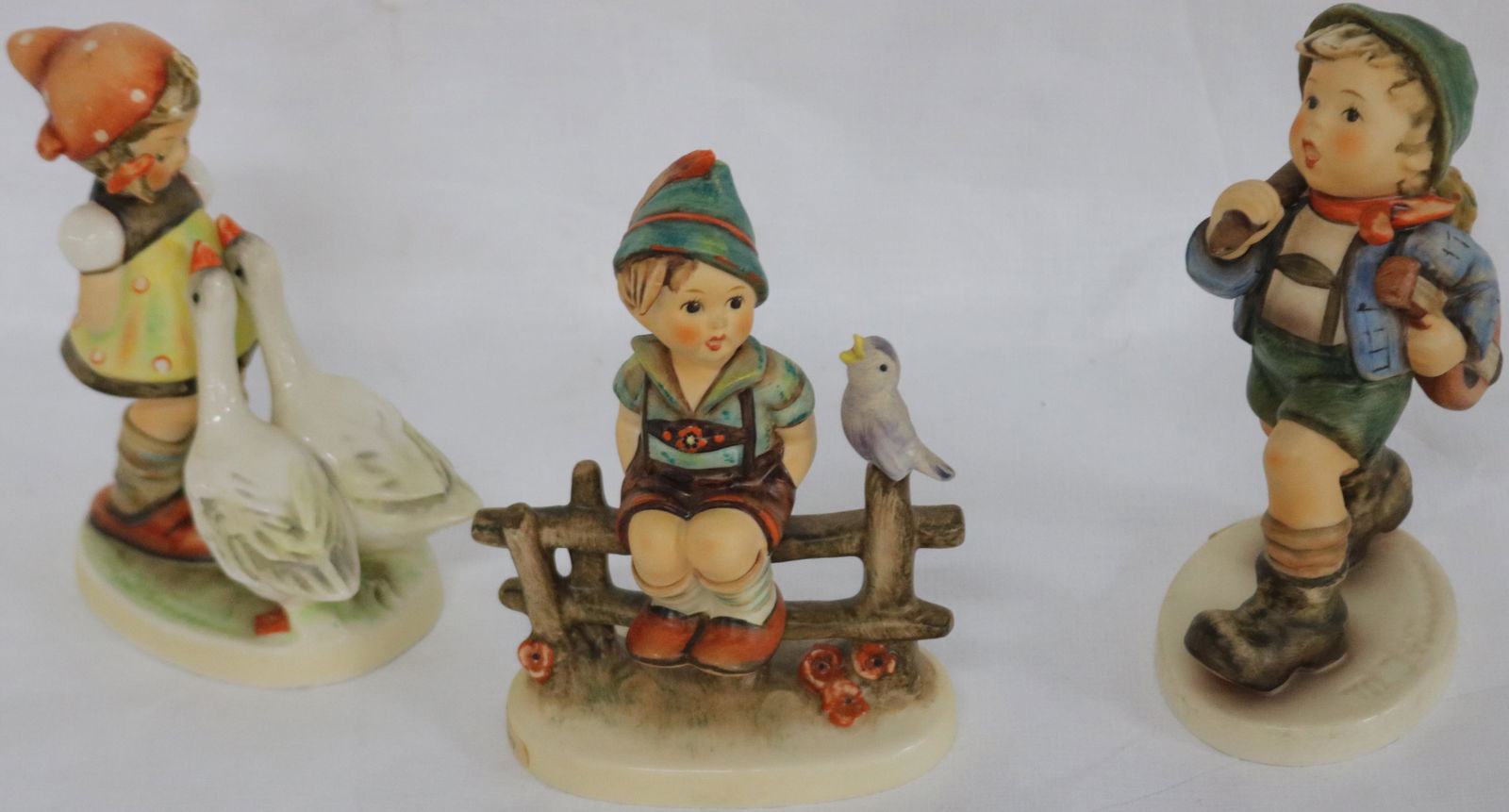 LOT OF 3 HUMMEL FIGURINES, GOEBEL MARK TO INCLUDE: THE RUNAWAY GOOSE GIRL AND WAYSIDE HARMONY, APPROX. 5" - 5 3/4" H