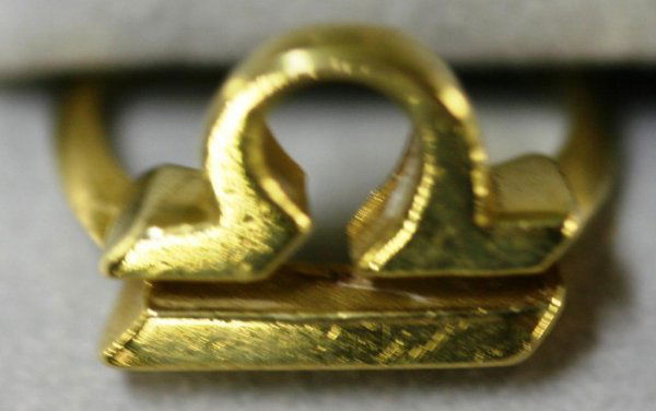 18K CARTIER LADIES RING WITH LIBRA SIGN 6.9 GRAMS: 18K CARTIER LADIES RING WITH LIBRA SIGN 6.9 GRAMS