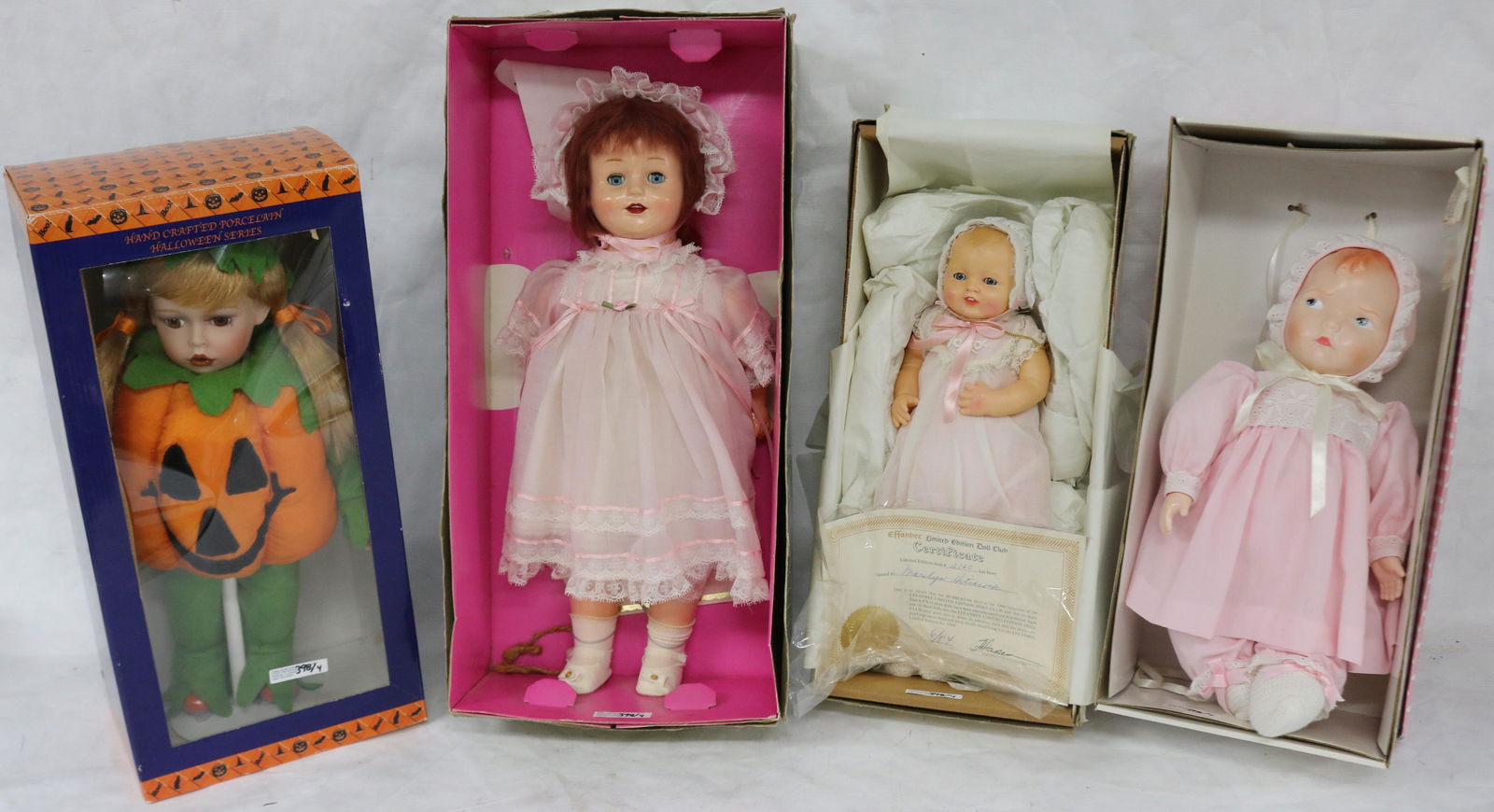 COLLECTION OF 4 DOLLS IN ORIGINAL BOXES TO: INCLUDE EFFANBEE BUBBES 94, HORSEMAN DOLLY ROSEBUD, CRACKER BARREL PUMPKIN, EFFANBEE BABY WITH GRUMPY FACE, 14" - 18" H
