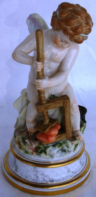 MEISSEN FIGURE OF ANGEL CRUSHING HEARTS #L104, CRO: MEISSEN FIGURE OF ANGEL CRUSHING HEARTS #L104, CROSS SWORDS MARK, 7 1/2" H, POSSIBLE RESTORATION TO WING