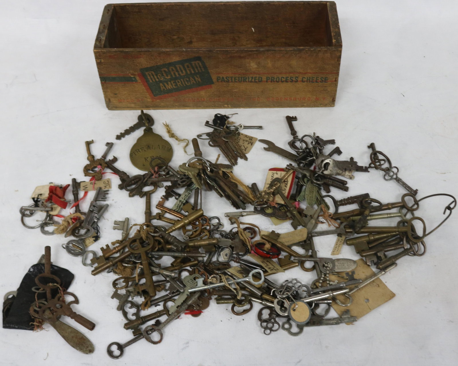 LARGE COLLECTION OF BRASS & IRON FURNITURE &: HOUSE KEYS, LOCK KEYS, FIRE ALARM KEY, ETC. IN ADVERTISING CHEESE BOX