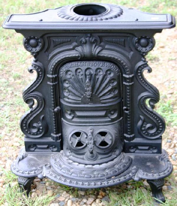 19TH C. ORNATE CUTE CAST IRON WOOD STOVE,: BY COLUMBIAN STOVE WORKS, 25" H, 23" W