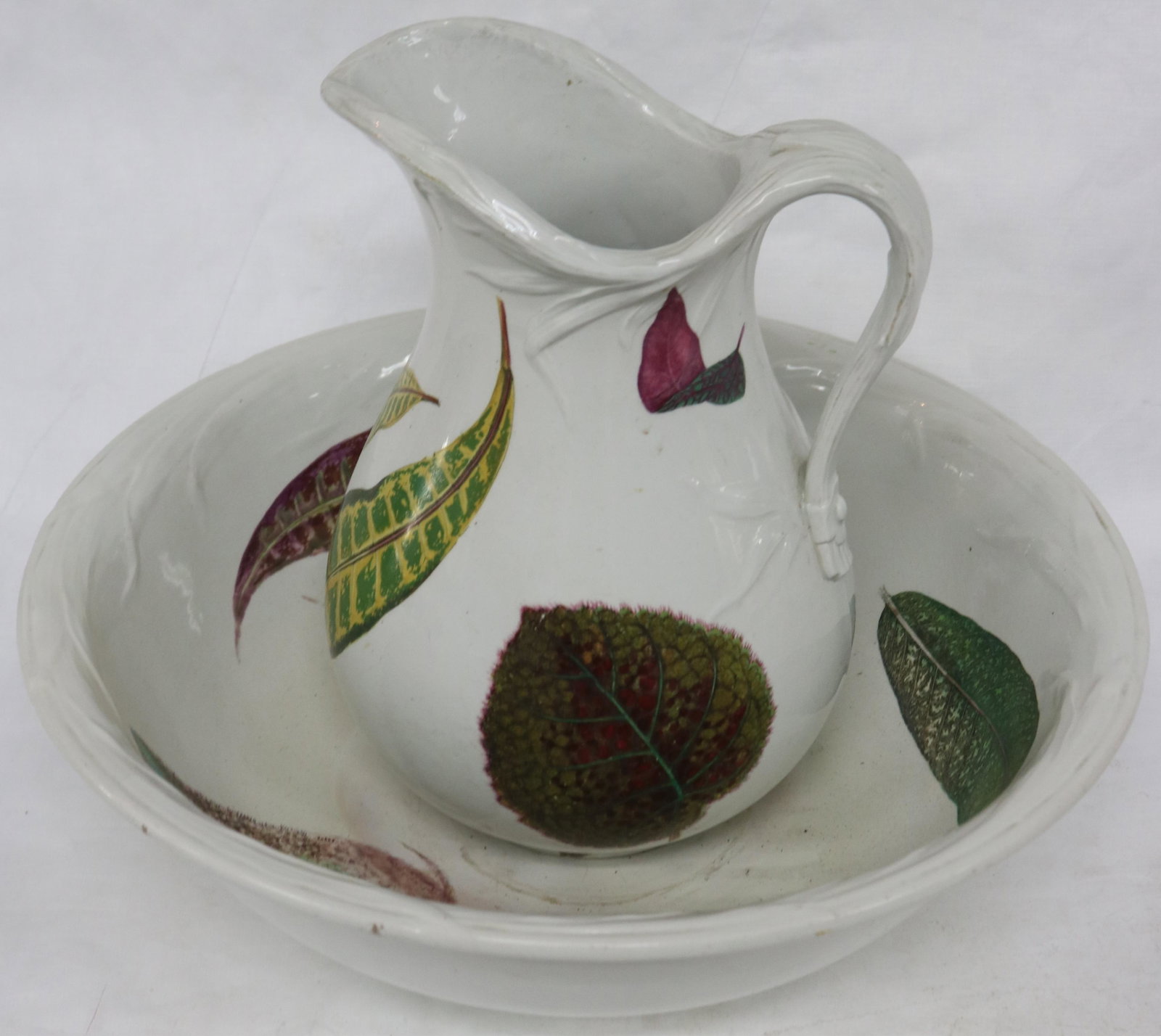 UNUSUAL IRONSTONE BOWL & PITCHER WITH LEAF: DESIGN, POSSIBLE RESTORATION TO BOWL, 12" H, OVERALL 16 1/2" DIA.