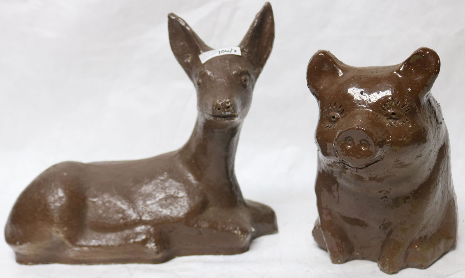 TWO 20TH C. OHIO SEWER TILE FIGURES, RESTING FAWN (1 of 2)