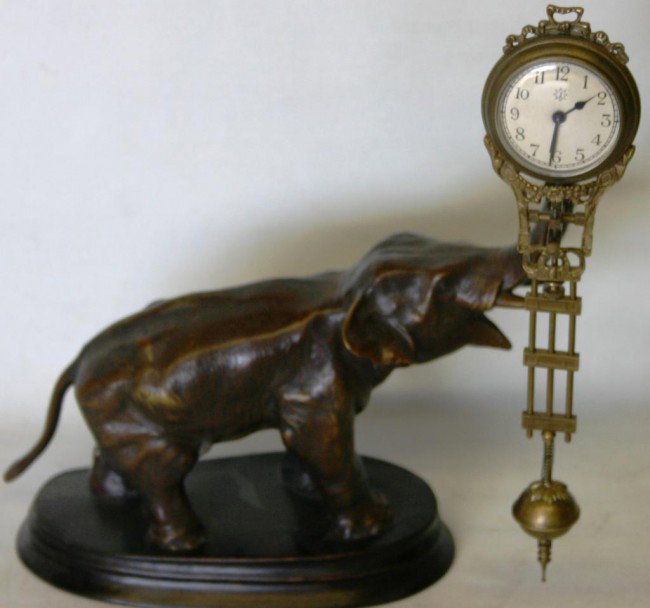 20TH C. BRONZE FIGURAL ELEPHANT SWING ARM CLOCK: WITH GERMAN MOVEMENT, 11" H, 10" L